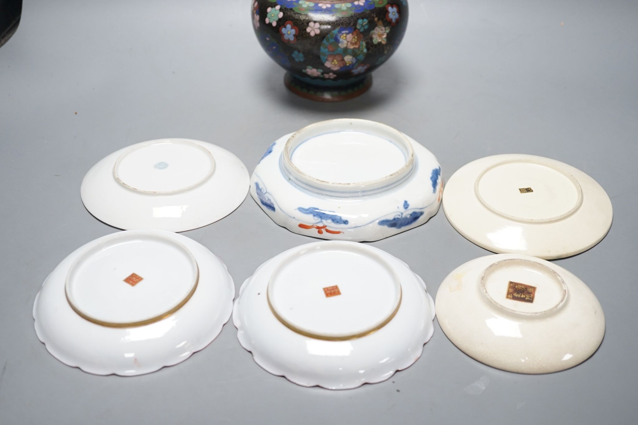 Two Japanese Satsuma pottery saucers, three Kutani saucers, and Imari dish and a Japanese cloisonné enamel koro and cover